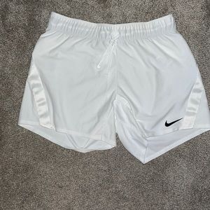 White Nike shorts